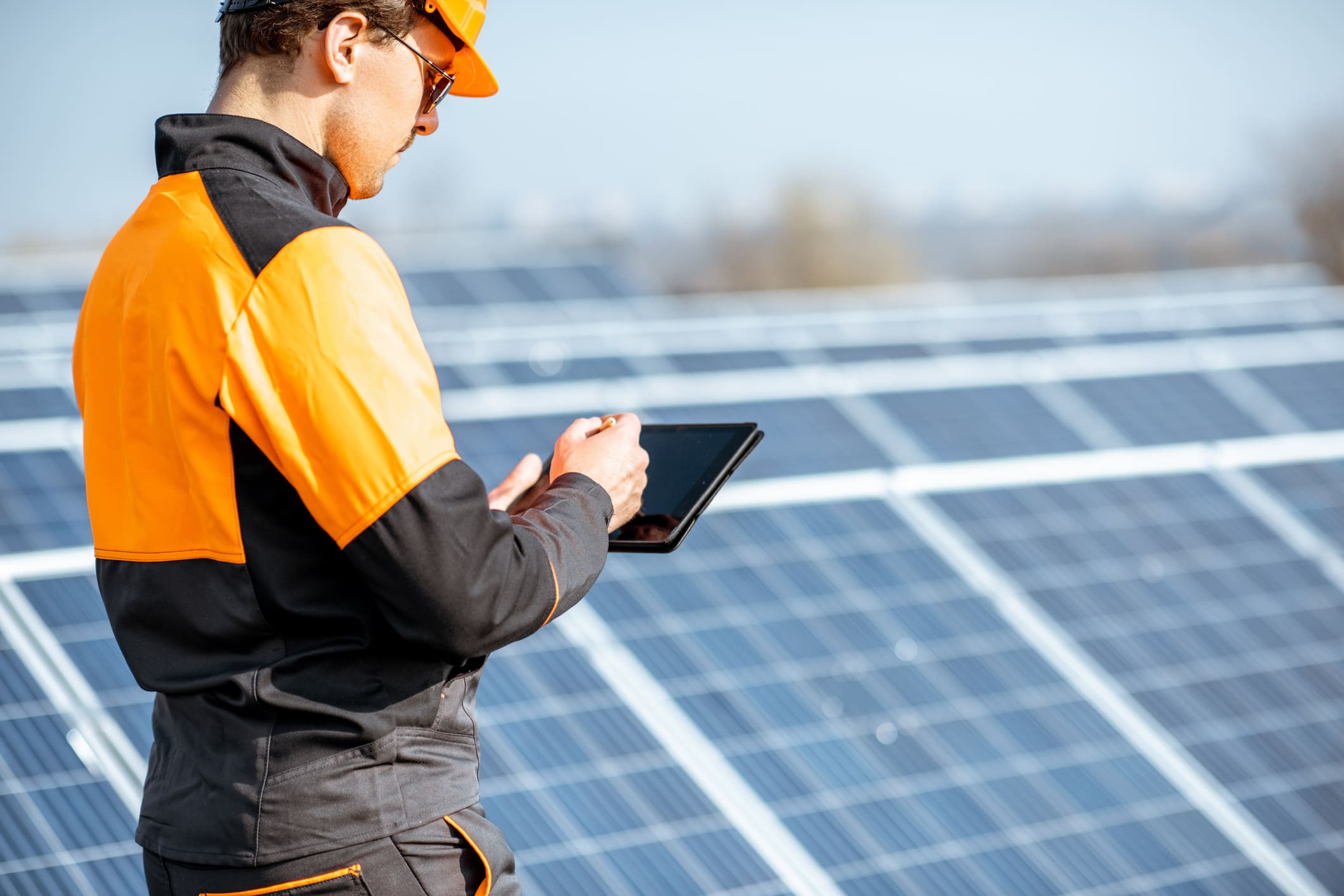 engineer servicing solar panels