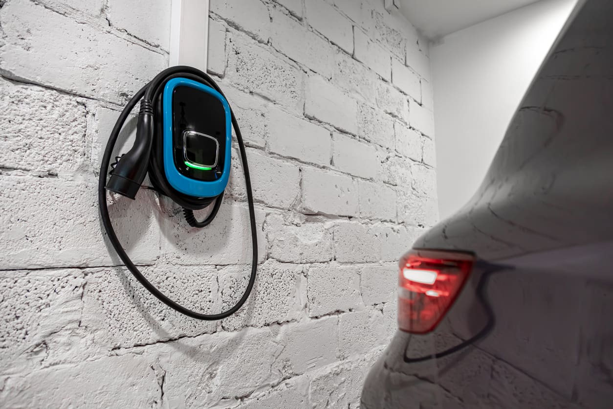 blue charging station on a wall